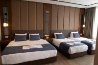 Postel nebo postele na pokoji v ubytování Martinenz Hotel