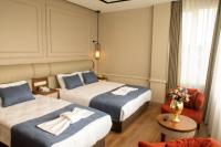 Postel nebo postele na pokoji v ubytování Martinenz Hotel
