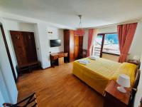 Telewizja i/lub zestaw kina domowego w obiekcie HG Hotel Italia