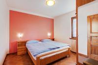 A bed or beds in a room at Chalet Meridiana Appartamento 8