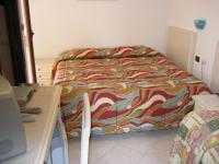 Posteľ alebo postele v izbe v ubytovaní Scano Comfort Inn