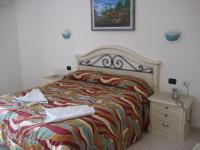 Posteľ alebo postele v izbe v ubytovaní Scano Comfort Inn