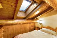 Posteľ alebo postele v izbe v ubytovaní Chalet Meridiana Appartamento 11