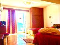 Posteľ alebo postele v izbe v ubytovaní delphi aiolos center hotel panoramic view&yoga harmony hotel&rooms