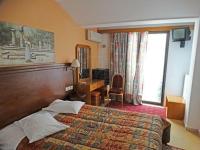 Posteľ alebo postele v izbe v ubytovaní delphi aiolos center hotel panoramic view&yoga harmony hotel&rooms