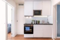 Kuchyňa alebo kuchynka v ubytovaní Vibe Apartments by Olala Homes