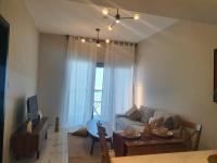 Posezení v ubytování Cozy 1-bedroom apartment in Dubai South with Pool