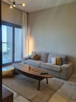Posezení v ubytování Cozy 1-bedroom apartment in Dubai South with Pool
