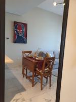 Posezení v ubytování Cozy 1-bedroom apartment in Dubai South with Pool