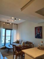 Posezení v ubytování Cozy 1-bedroom apartment in Dubai South with Pool