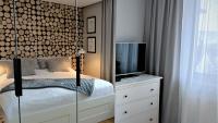 Łóżko lub łóżka w pokoju w obiekcie Apartamenty Granitica Zakopane