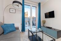 TV a/nebo společenská místnost v ubytování Platinum Tartaczna Apartments by Noclegi Renters