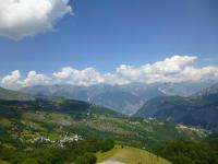 a view of a valley with mountains and a road at Studio Pegase Phenix-44 by Interhome in Le Corbier