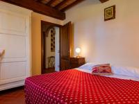A bed or beds in a room at Apartment Michelangelo by Interhome