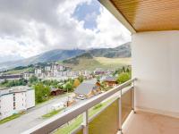 a balcony with a view of a city and mountains at Apartment Champ Bozon by Interhome in La Toussuire