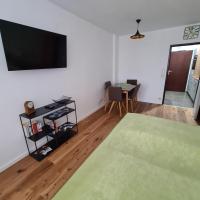 Televízia a/alebo spoločenská miestnosť v ubytovaní Ferienwohnung Ausseerland