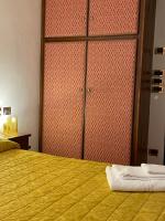 Łóżko lub łóżka w pokoju w obiekcie HG Hotel Italia
