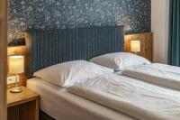 Posteľ alebo postele v izbe v ubytovaní Landhaus Hubertus Wellness & Breakfast