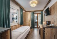 Posteľ alebo postele v izbe v ubytovaní Landhaus Hubertus Wellness & Breakfast