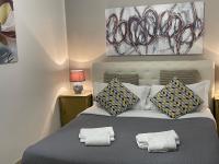 A bed or beds in a room at B&B Maggiore 58