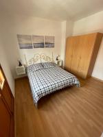A bed or beds in a room at Precioso adosado con parking a 100 metros de la playa