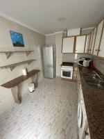 A kitchen or kitchenette at Precioso adosado con parking a 100 metros de la playa