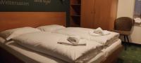 Łóżko lub łóżka w pokoju w obiekcie Yako Apartment - Wagrain Center