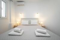 Łóżko lub łóżka w pokoju w obiekcie Anius Apartments
