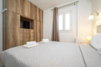 Łóżko lub łóżka w pokoju w obiekcie Anius Apartments