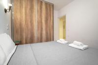 Łóżko lub łóżka w pokoju w obiekcie Anius Apartments