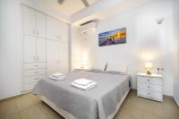 Łóżko lub łóżka w pokoju w obiekcie Anius Apartments