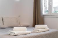 Łóżko lub łóżka w pokoju w obiekcie Anius Apartments
