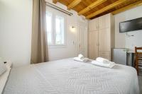 Łóżko lub łóżka w pokoju w obiekcie Anius Apartments