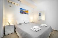 Łóżko lub łóżka w pokoju w obiekcie Anius Apartments