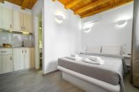 Łóżko lub łóżka w pokoju w obiekcie Anius Apartments