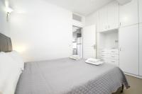 Łóżko lub łóżka w pokoju w obiekcie Anius Apartments
