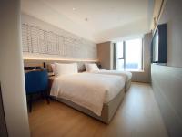 lyf Xi'an Dayanta by Ascott free gym & self-service free laundry roomにあるベッド
