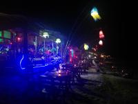 a street at night with tables and lights at Lanta Fa Rung Beach Resort in Ko Lanta