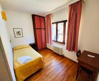 Łóżko lub łóżka w pokoju w obiekcie HG Hotel Italia