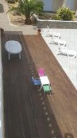 a toy train on a deck with a table and chairs at villa 15 personnes avec piscine et terrain de pétanque in Puysserampion
