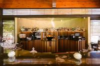 a bar in a room with a lot of bottles at Hotel Rural Xereca in Puig D’en Valls