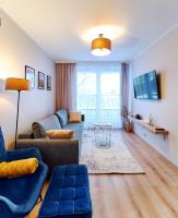 Televízia a/alebo spoločenská miestnosť v ubytovaní LAGUNA Apartament Polanica Residence 12