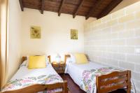 A bed or beds in a room at Home2Book Las Mimbreras