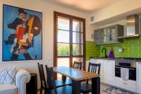 A kitchen or kitchenette at La Casa Sul Porto - Italian Homing