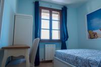 A bed or beds in a room at La Casa Sul Porto - Italian Homing
