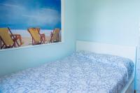 A bed or beds in a room at La Casa Sul Porto - Italian Homing