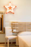 A bed or beds in a room at La Casa Sul Porto - Italian Homing