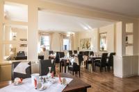 Un restaurante u otro lugar para comer en Gutshof Havelland