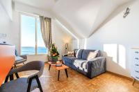 a living room with a couch and a table at Best Western Hotel De La Plage Saint Marc sur Mer in Saint-Nazaire