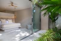 Ein Bett oder Betten in einem Zimmer der Unterkunft Cielo Boutique Hotel & Spa Samui